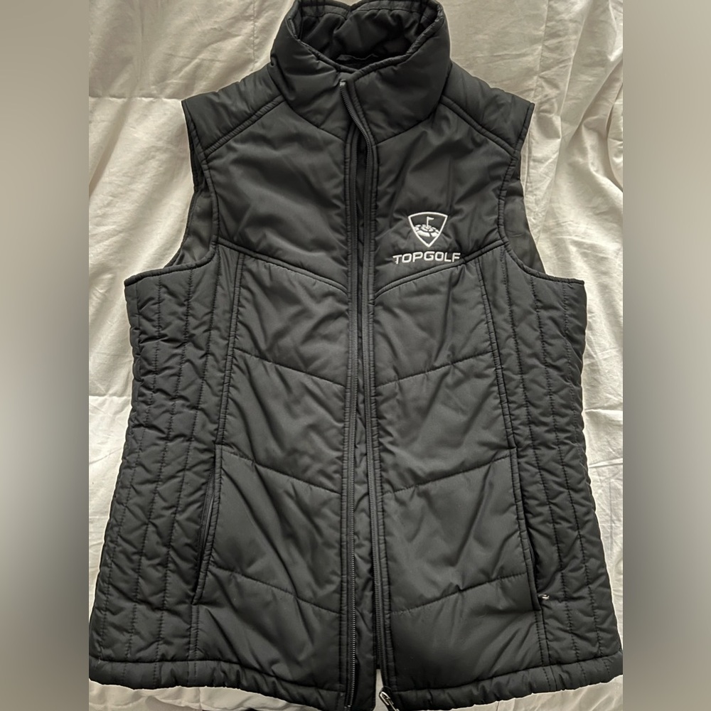 Woman’s small black topgolf vest, multiple pockets inside and out!